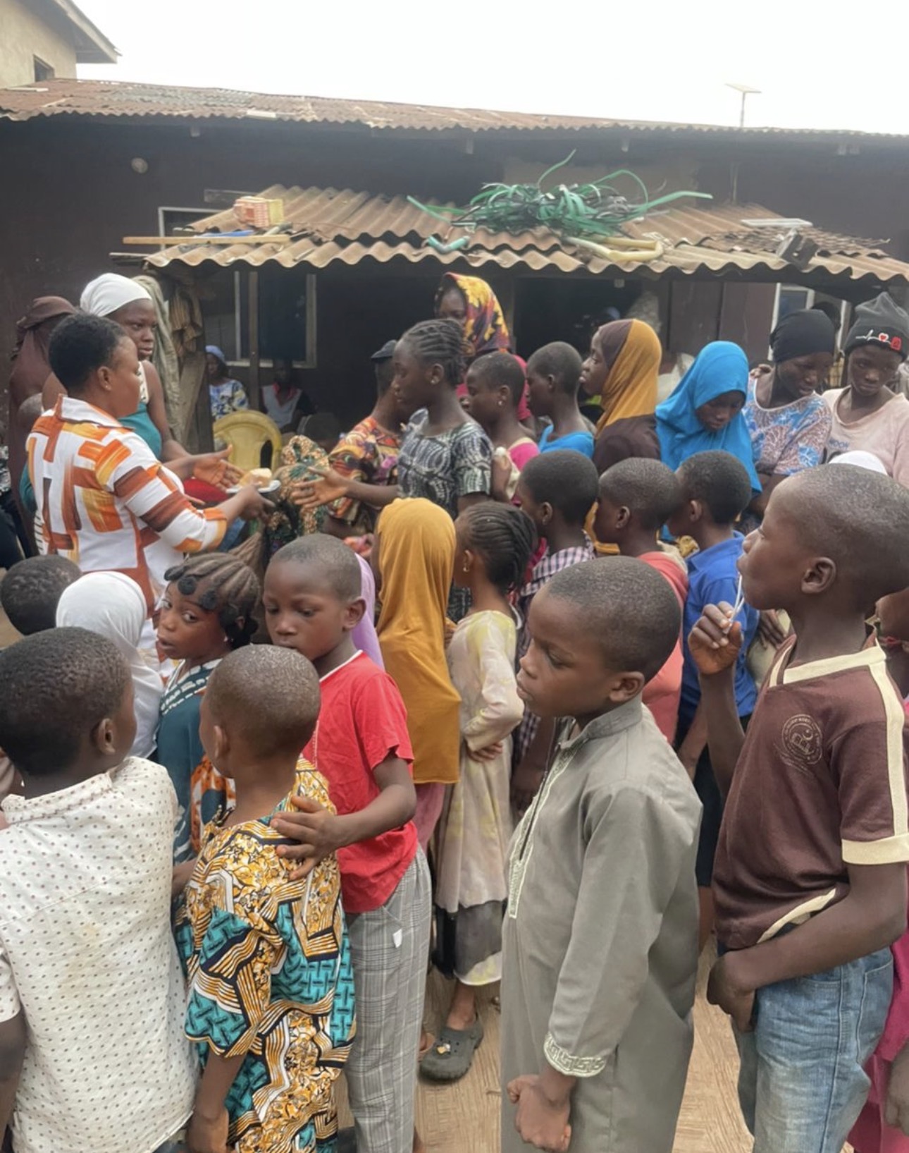 Families and children gathered at a community outreach